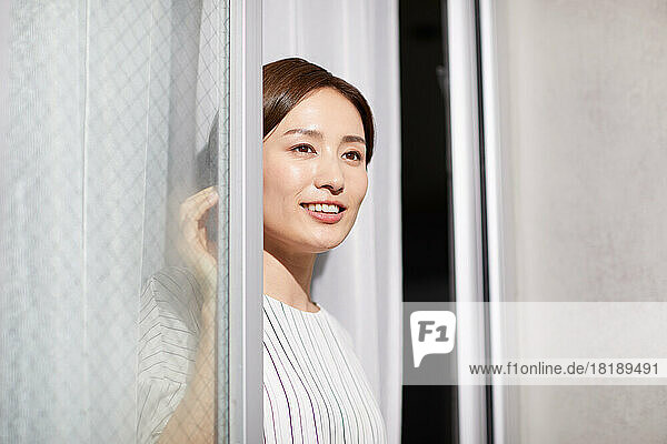 Japanese woman looking out the window
