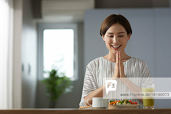 Japanese woman eating at home
