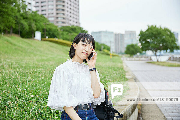Young Japanese woman at city park