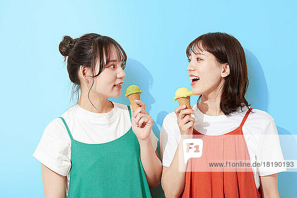 Young Japanese women eating ice cream