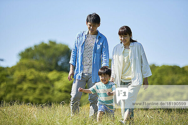 Fresh greenery and smiling Japanese family