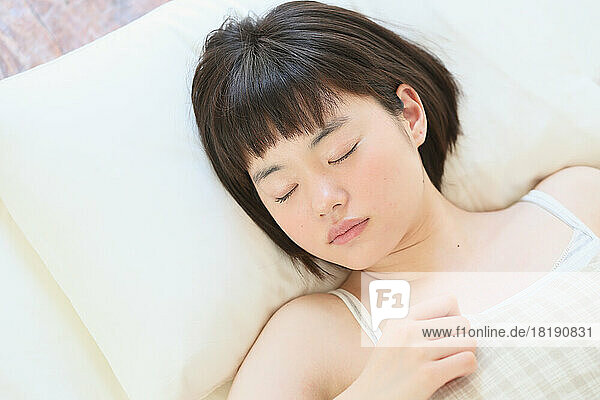 Young Japanese woman sleeping