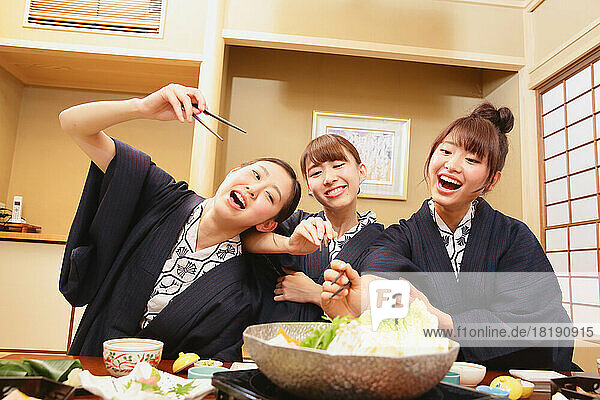 Japanese women having dinner at a hot spring inn