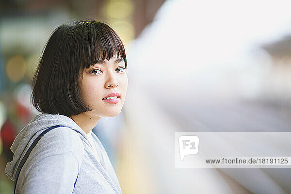 Young Japanese woman on the train platform