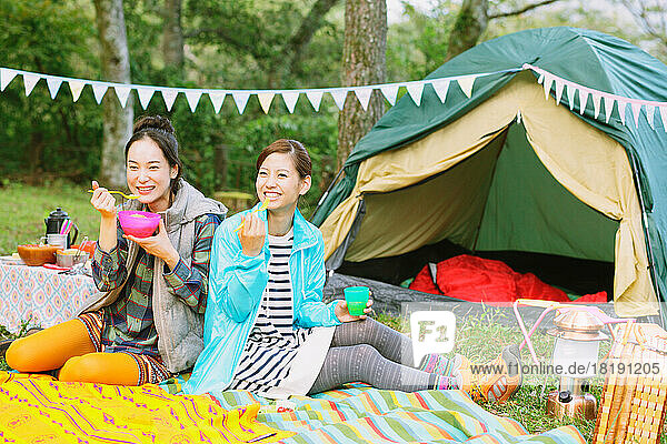 Two Japanese women camping