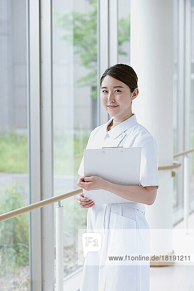 Young Japanese female nurse in the hallway
