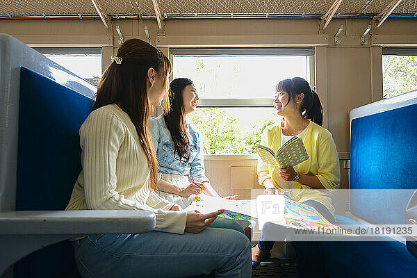 Japanese women traveling by train
