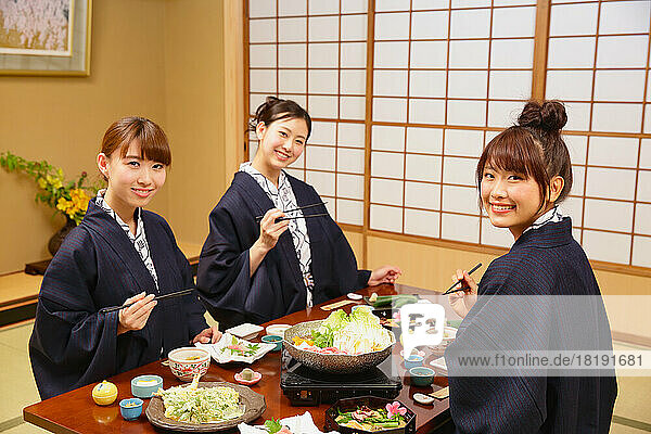Japanese women having dinner at a hot spring inn