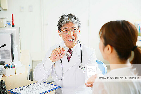 Japanese woman being examined by a doctor