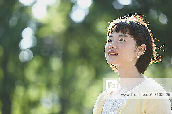 Young Japanese woman walking in the park