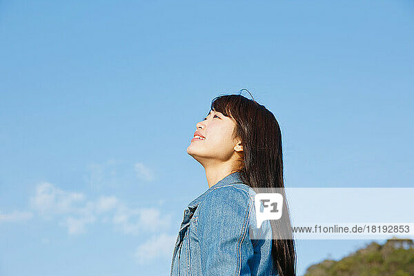 Young Japanese woman looking into the distance