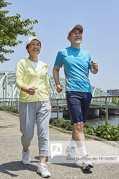 Japanese senior couple walking