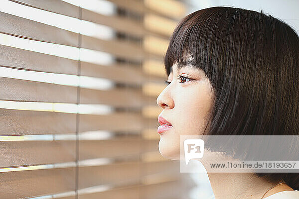 Young Japanese woman by the window