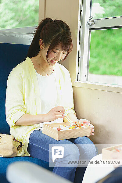 Japanese woman eating lunch box