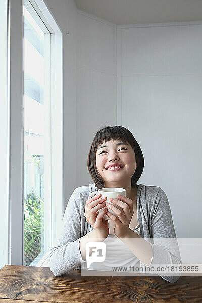 Young Japanese woman drinking tea