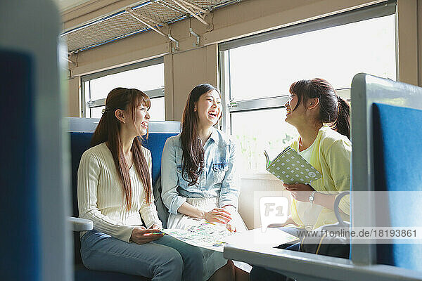 Japanese women traveling by train