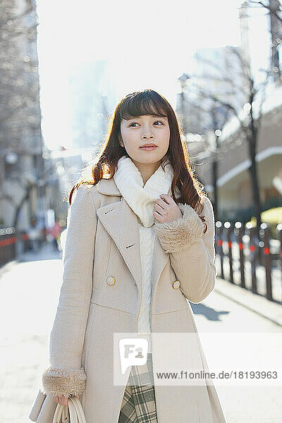 Japanese woman walking in the city during the winter