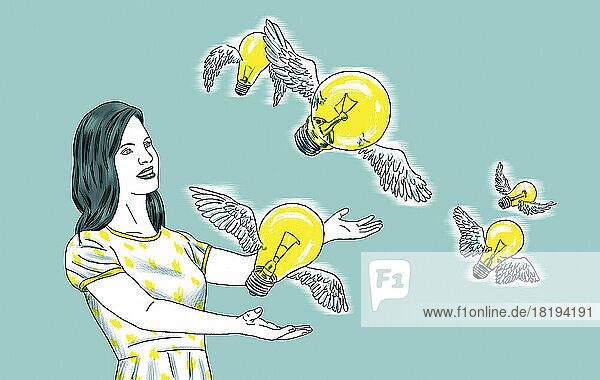 Frau lässt Glühbirnenvögel frei