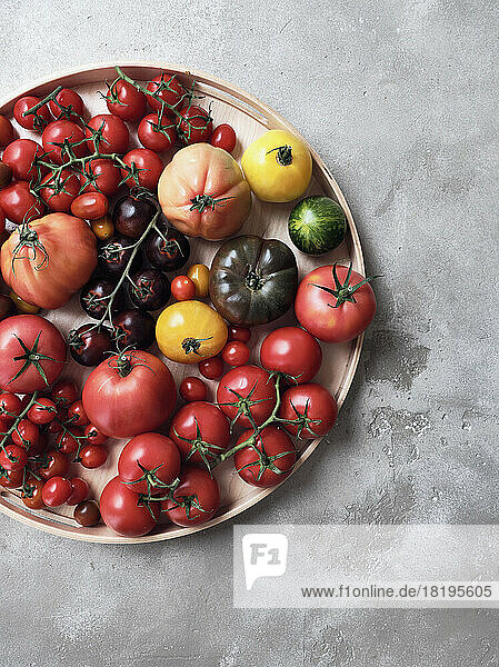 Still life variety of fresh tomatoes on tray