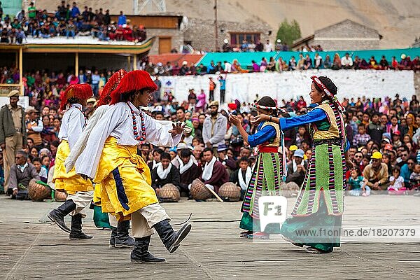 LEH  INDIA  SEPTEMBER 08  2012: Young dancers in traditional Ladakhi Tibetan costumes perform folk dance at the Annual Festival of Ladakh Heritage in Leh  India. September 08  2012