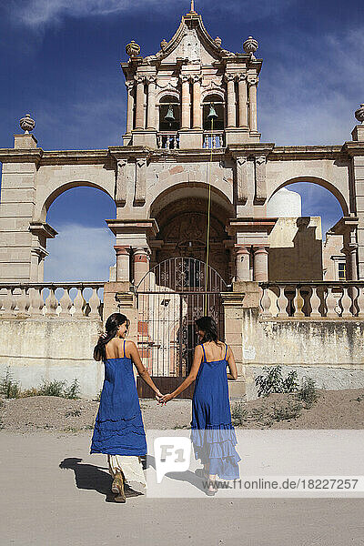 Mexico  San Felipe  Two women walking towards old church