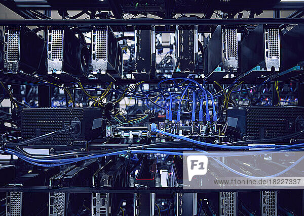 Close-up of computer cables and hard drives in server room