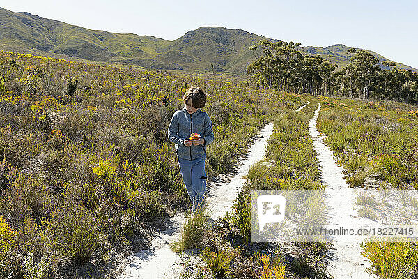 South Africa  Stanford  Boy (8-9) walking on nature trail at Phillipskop Mountain Reserve
