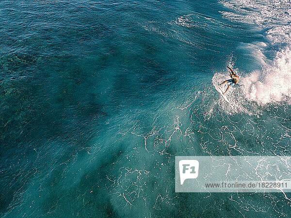 Aerial view of surfer on a wave