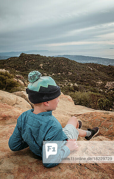 USA  California  Boy (8-9) looking at landscape