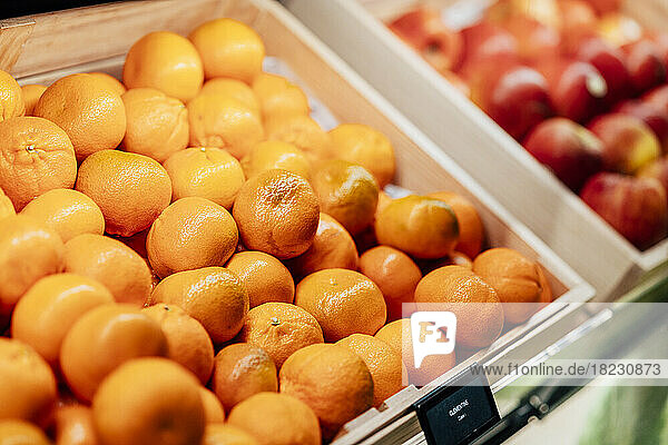 Fresh organic tangerines at market stall