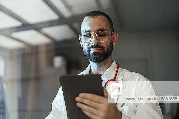 Doctor using tablet PC in hospital