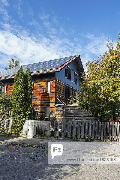Germany  Bavaria  Munich  Street in front of modern passive house equipped with solar panels
