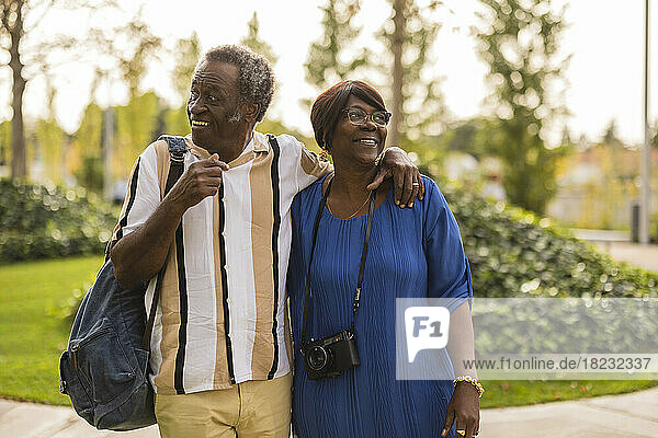 Senior couple enjoying with each other in park