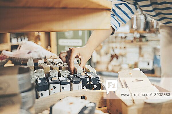 Customer picking up soap bar in sustainable store
