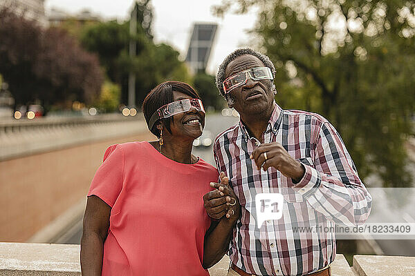 Senior couple wearing smart glasses