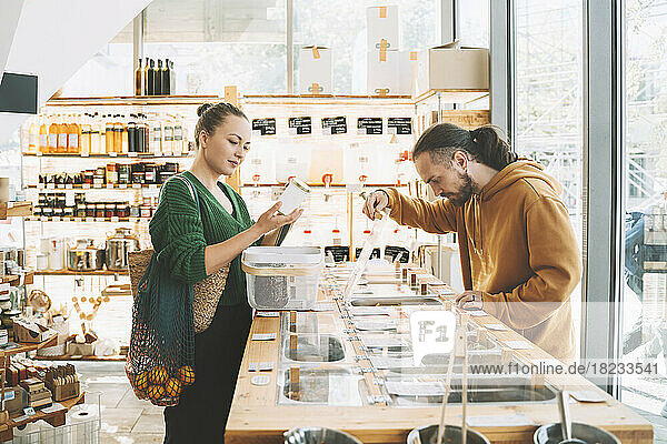 Couple shopping together in zero waste shop