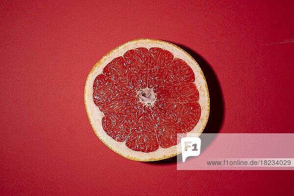 Studio shot of halved grapefruit