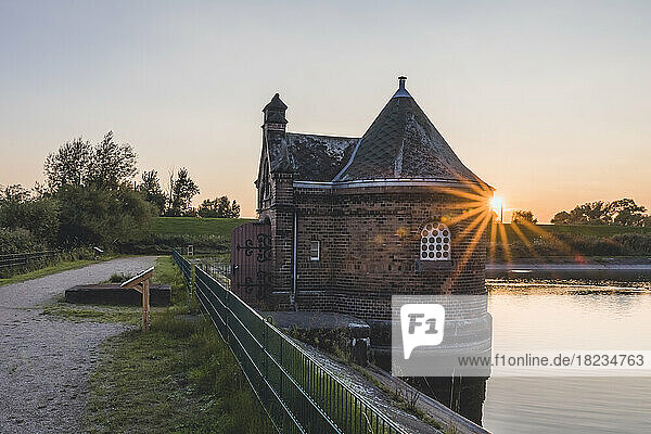 Germany  Hamburg  Historic filter house on Kaltehofe island at sunset