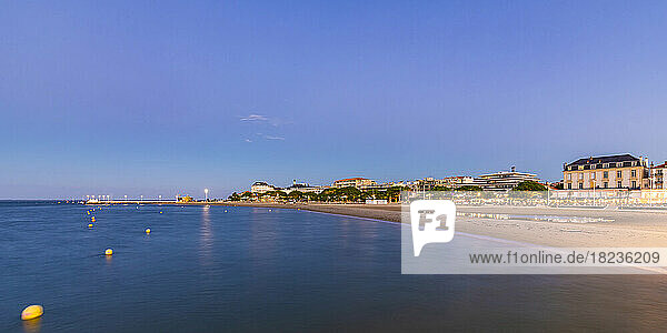 France  Nouvelle-Aquitaine  Arcachon  Panoramic view of empty beach of Arcachon Bay at dusk