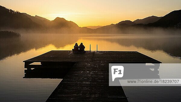 People enjoying the morning atmosphere at sunrise  Steg am Fuschlsee  near Fuschl am See  Salzkammergut  Salzburger Land  Land Salzburg  Austria  Europe