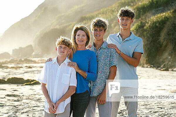 Portrait Of Mother And Three Teen Sons At The Beach
