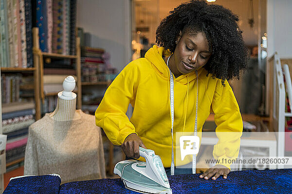 African-American girl in her sewing workshop.