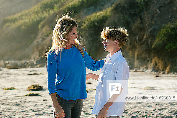 Mother And Son At The Beach Smile At Each Other
