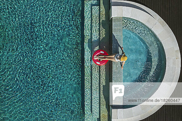 Aerial view of woman in swimming pool