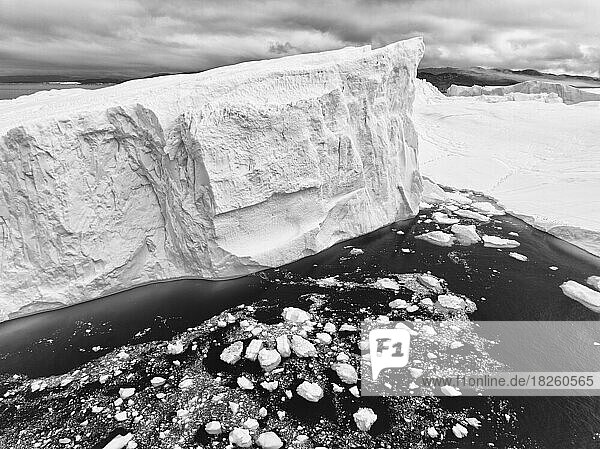 detail of extreme icebergs from aerial view in black and white