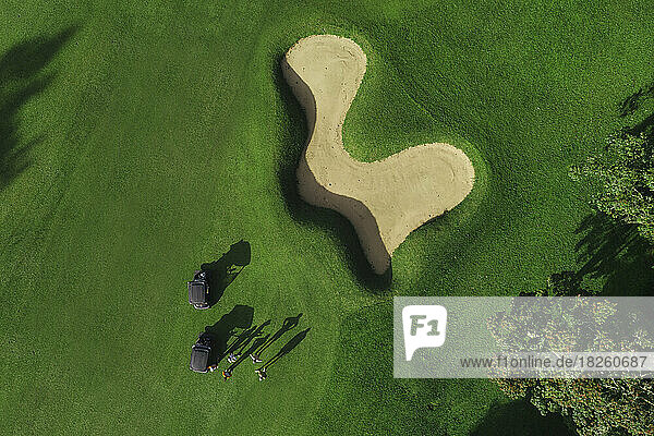 Aerial view of players at golf field