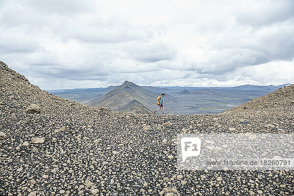 A boy hiking in the northern mountains of Iceland