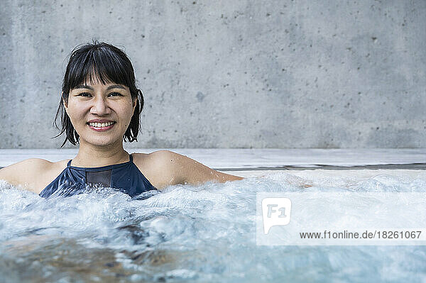 woman enjoying a thermal spa bath in the Dolomites