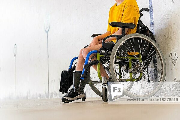 Detail of a disabled person in a wheelchair at a Basque pelota game fronton