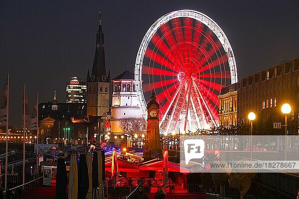 Rhine promenade with castle tower and illuminated Ferris wheel at dusk  Düsseldorf  North Rhine-Westphalia  Germany  Europe